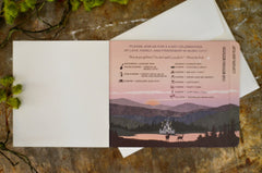 Dramatic Dusk over Lake Fairytale Castle with Tuscan Greenery Livret Wedding Invitation with A7 Envelope